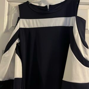 Super cute Navy blue and white short fitted dress. Partial open on shoulders.
